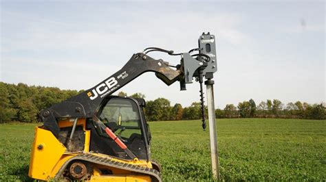 john deere skid steer post pounder|post pounder attachment for bobcat.